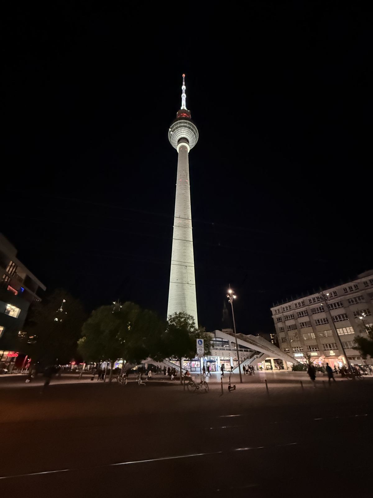 The Fernsehturm at night above an empty Alexanderplatz