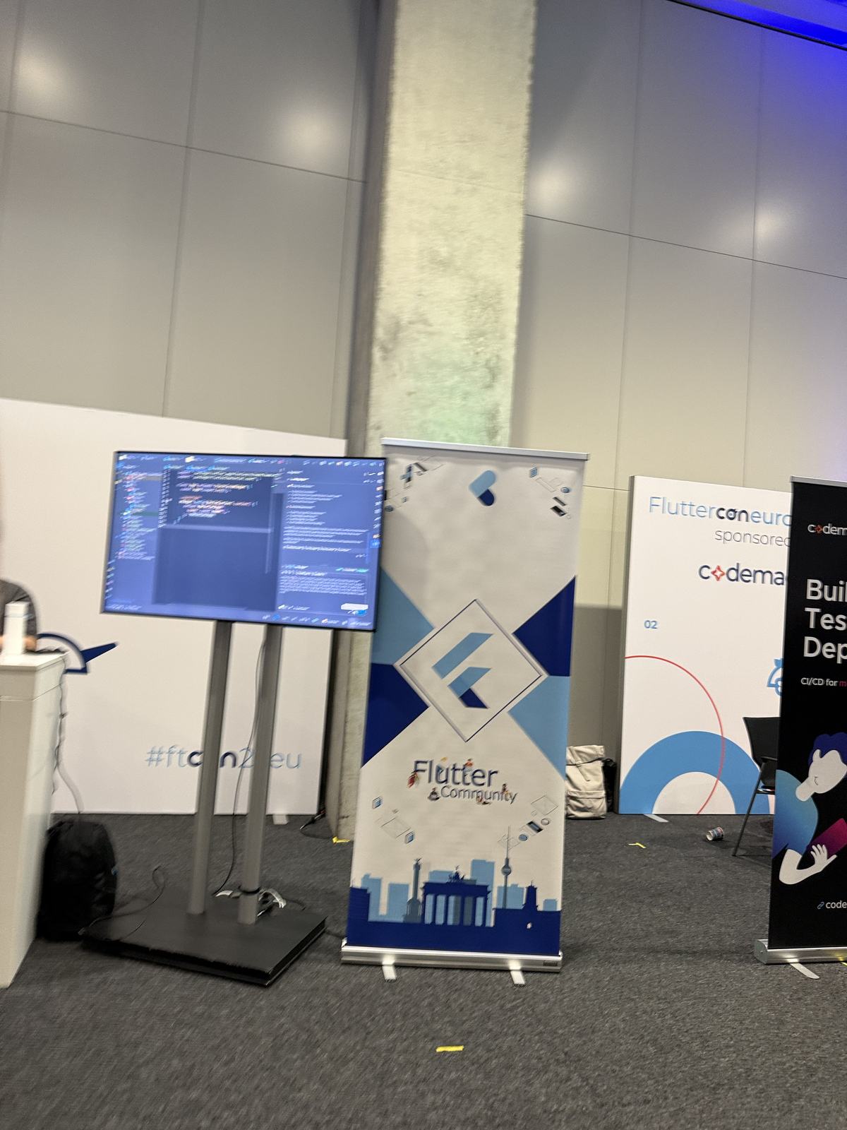 Flutter Community and Codemagic banners at the venue
