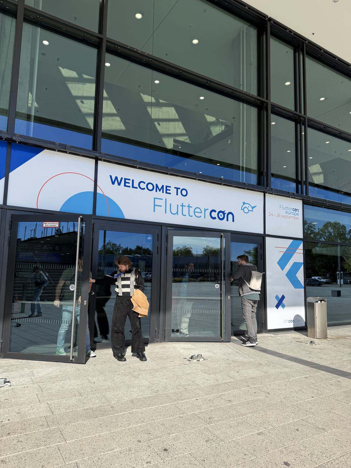 The Welcome to Fluttercon doors at the CityCube entrance