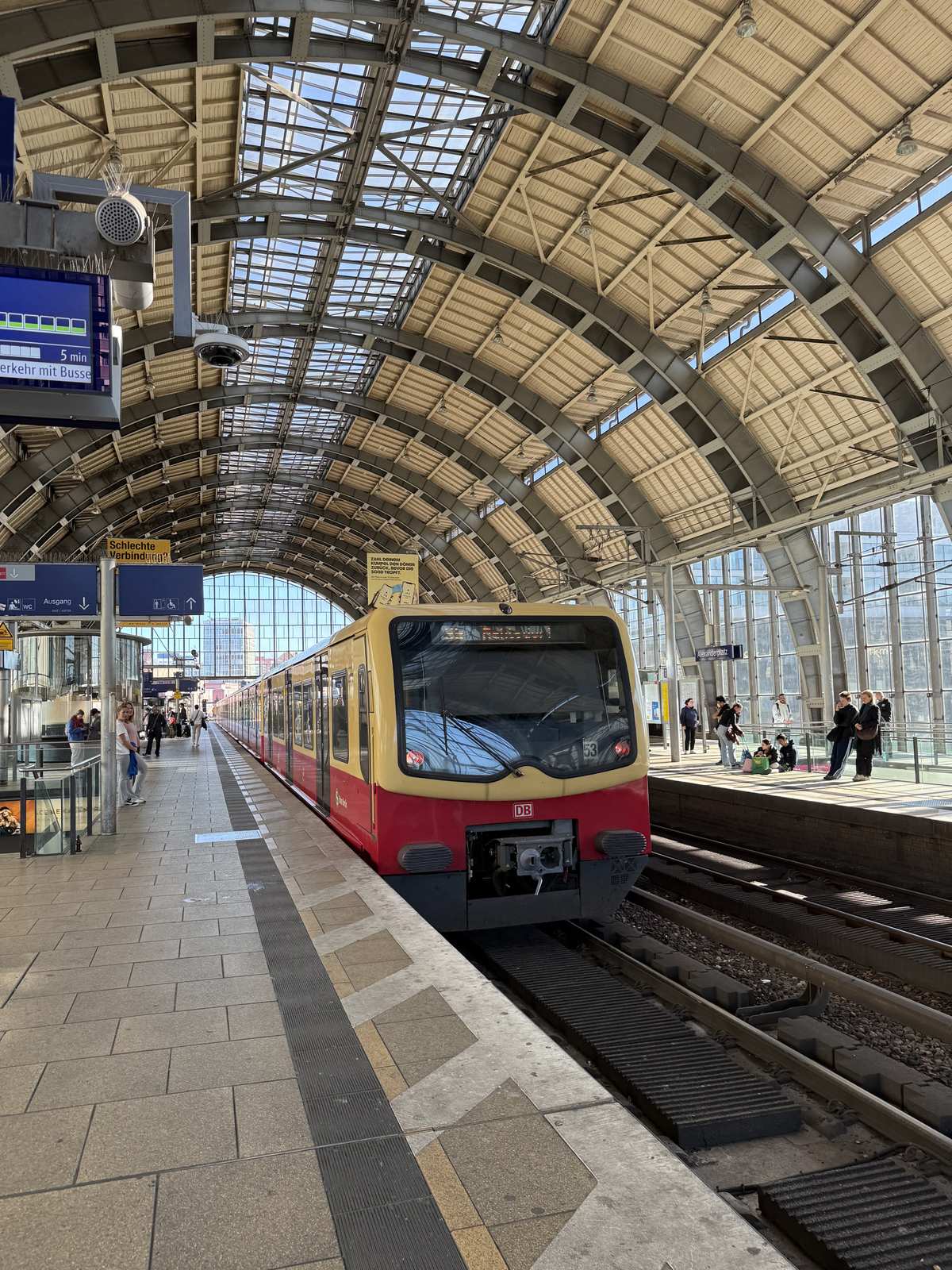 A train under the glass roof of a Berlin station