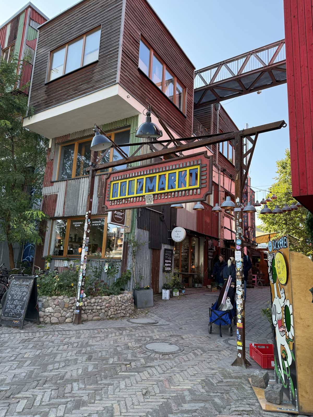 The painted timber buildings at the entrance to Holzmarkt in Berlin