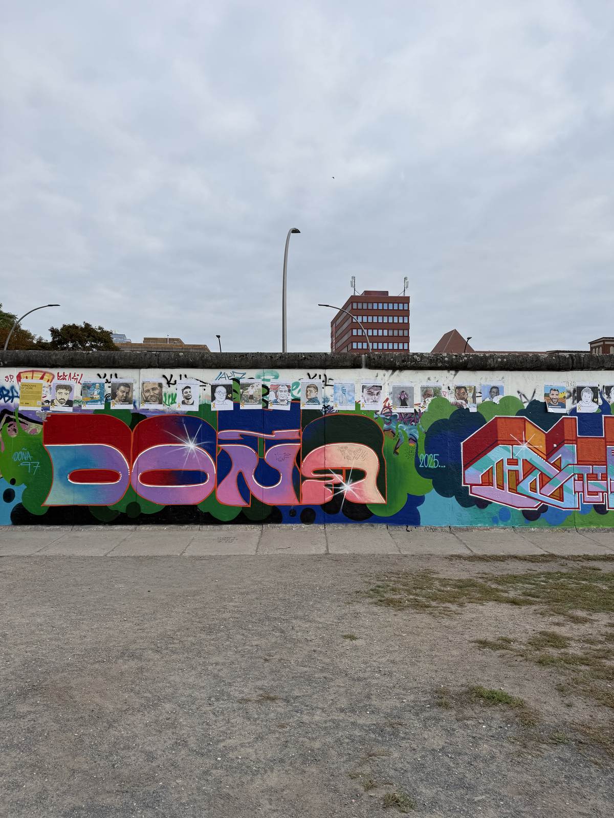 A colourful mural on a standalone section of wall