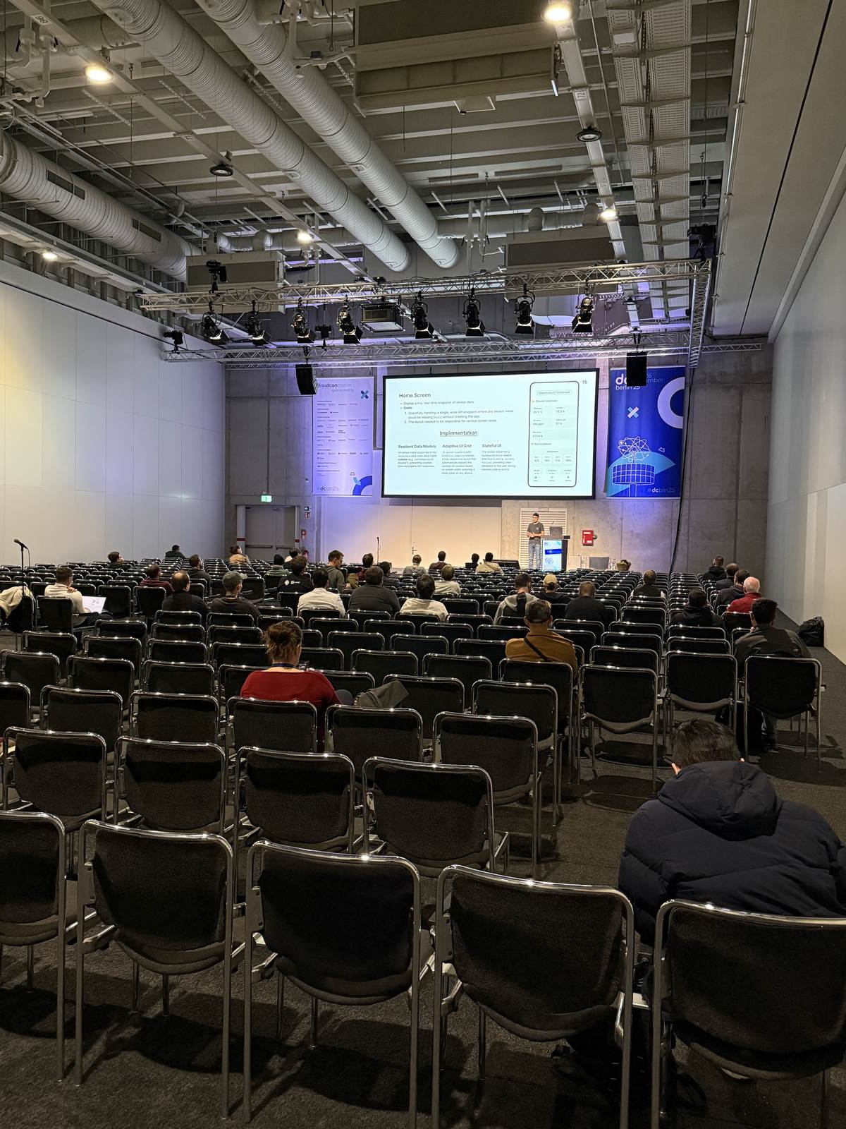 A session room filling up before the talk starts