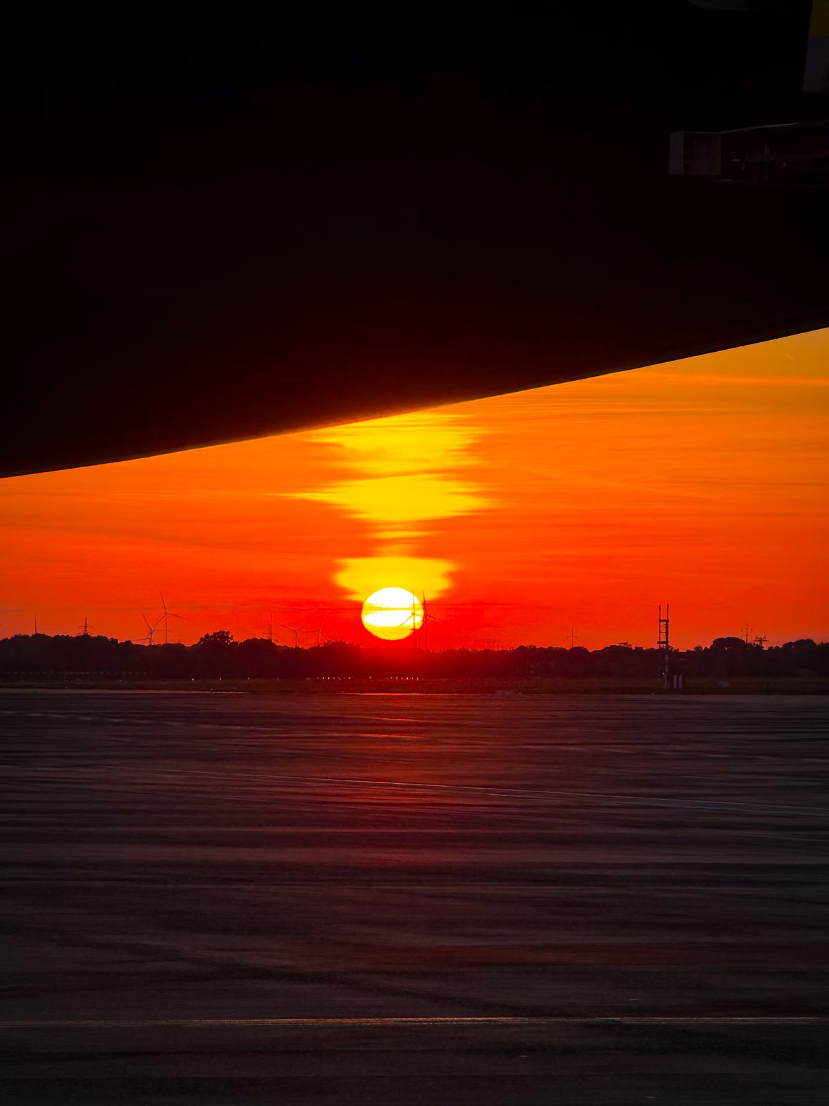 The sun on the horizon seen from the air