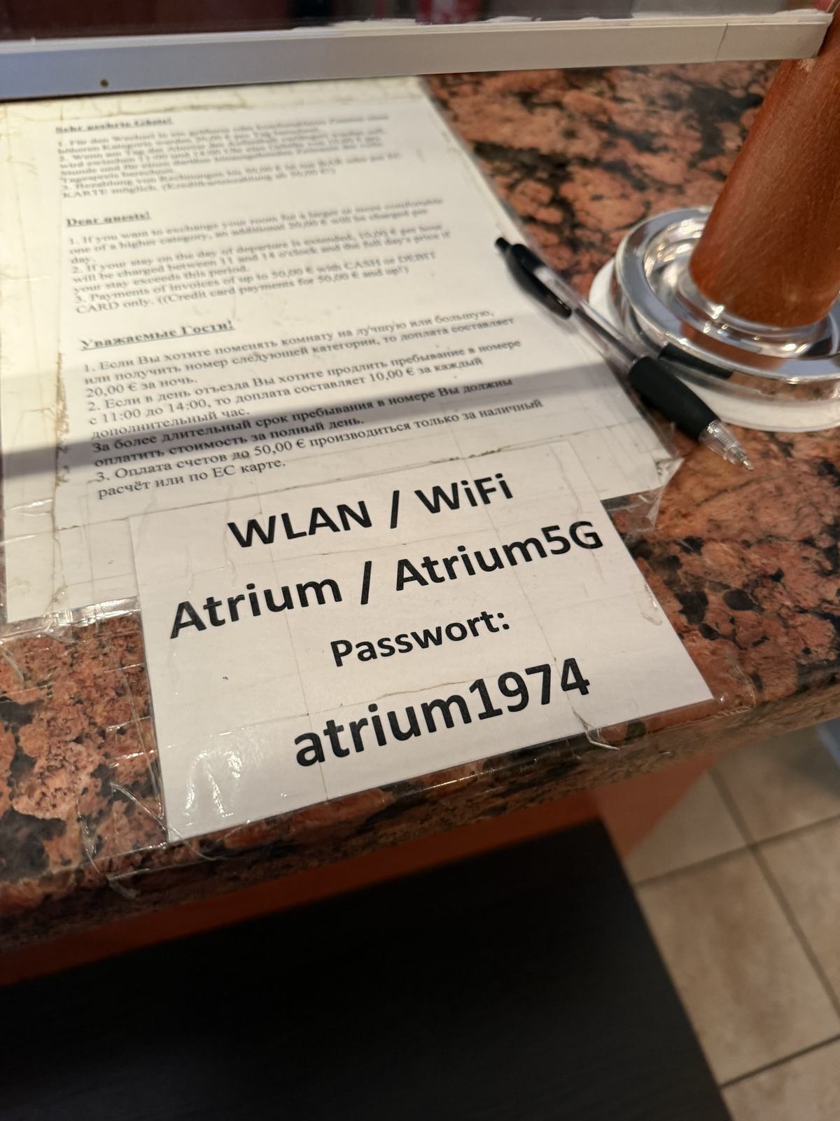 A card with the WLAN name and password on a table