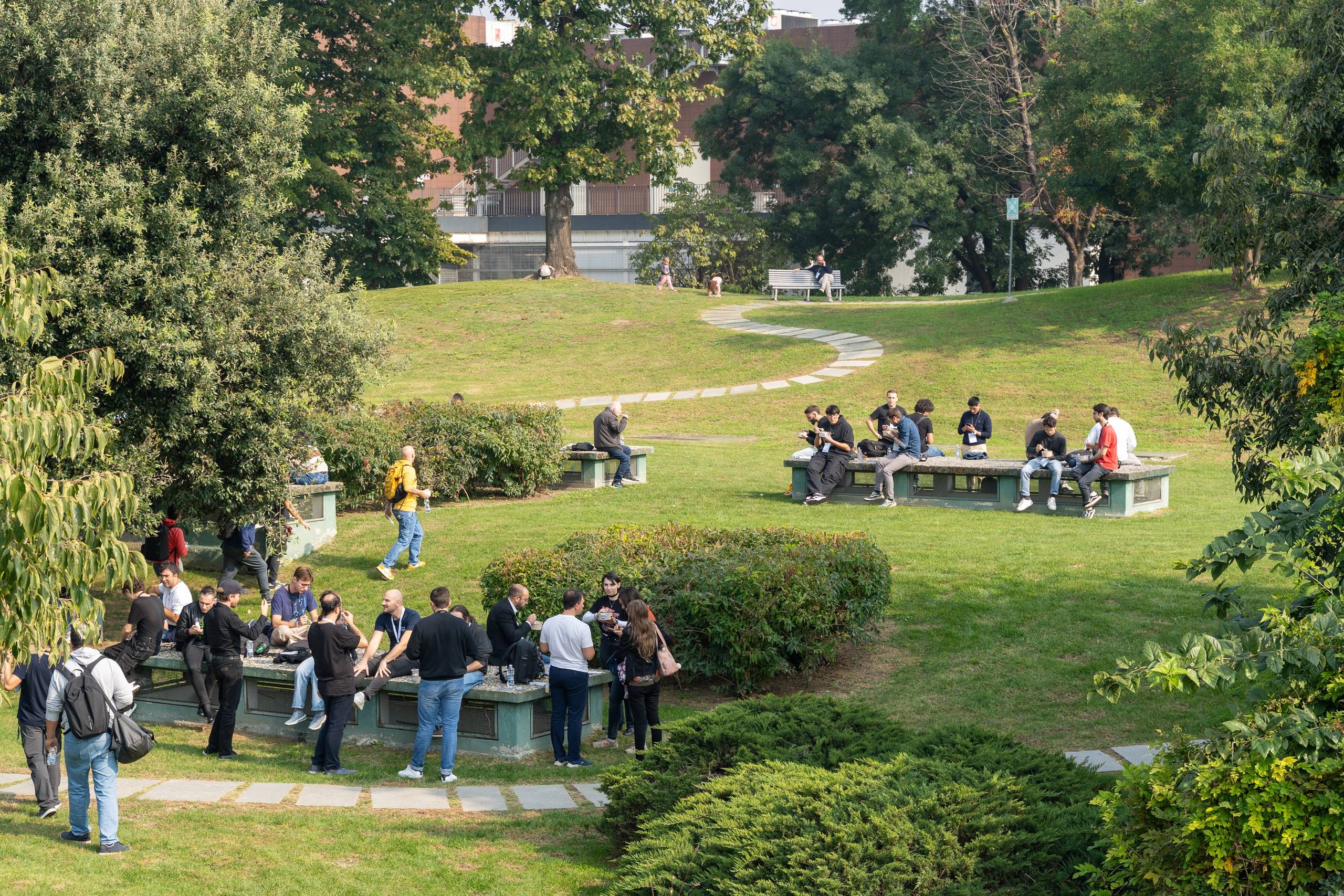 The park seen from above with attendees at picnic tables on the grass