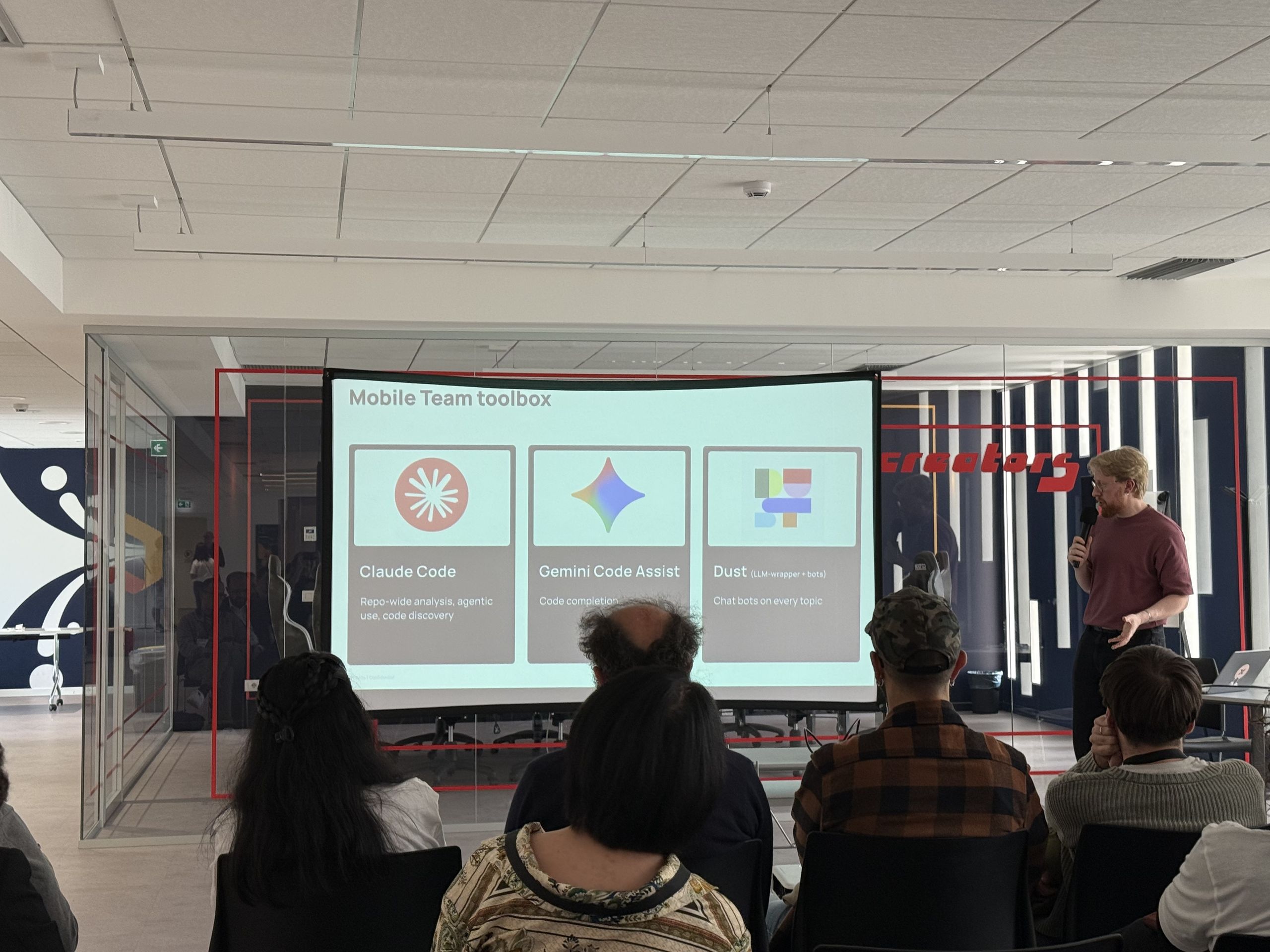 The room during the Mobile Team toolbox talk, with the slide on the projection screen