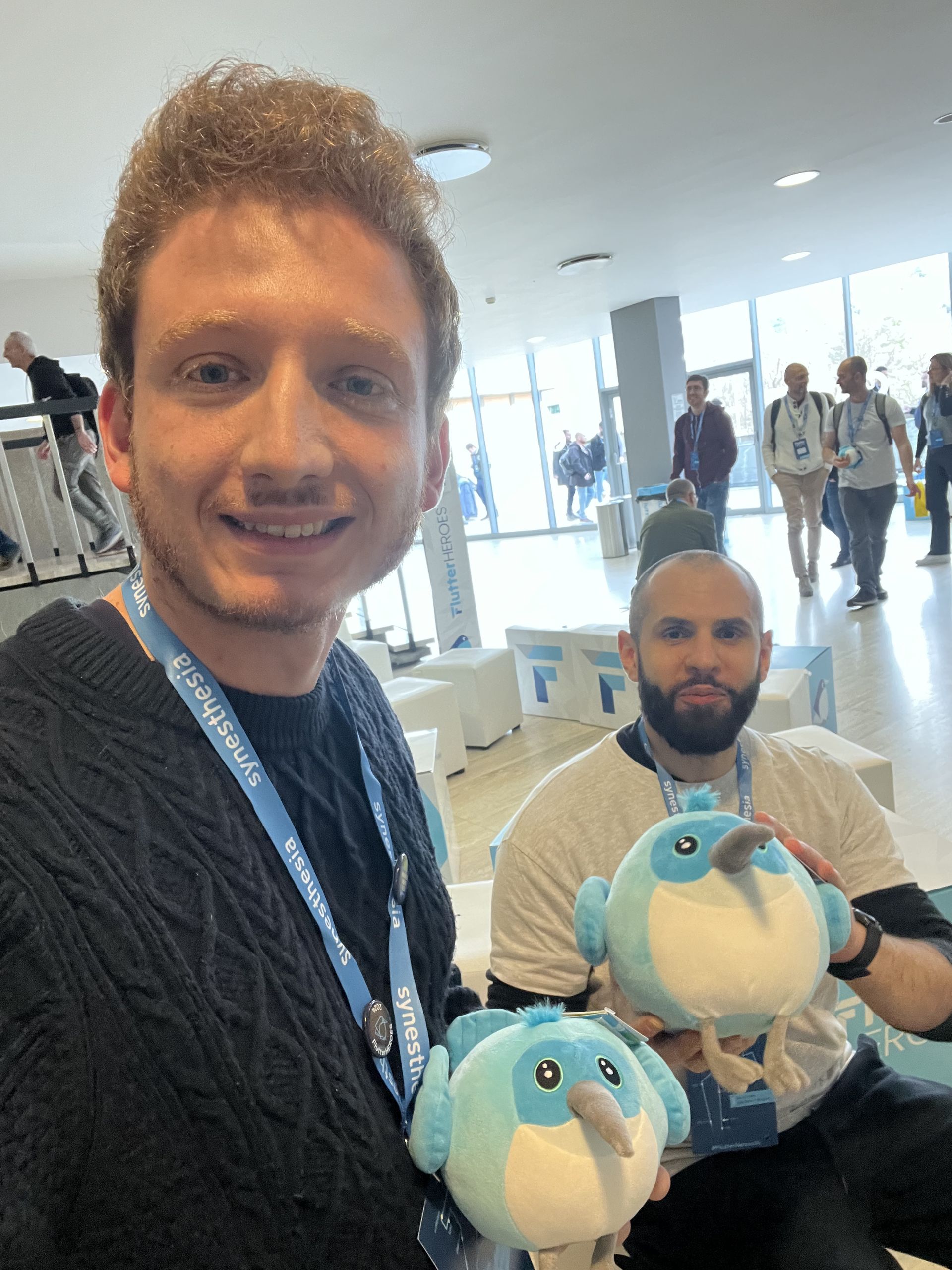Selfie with a colleague and the two Dash plushes at the swag desk
