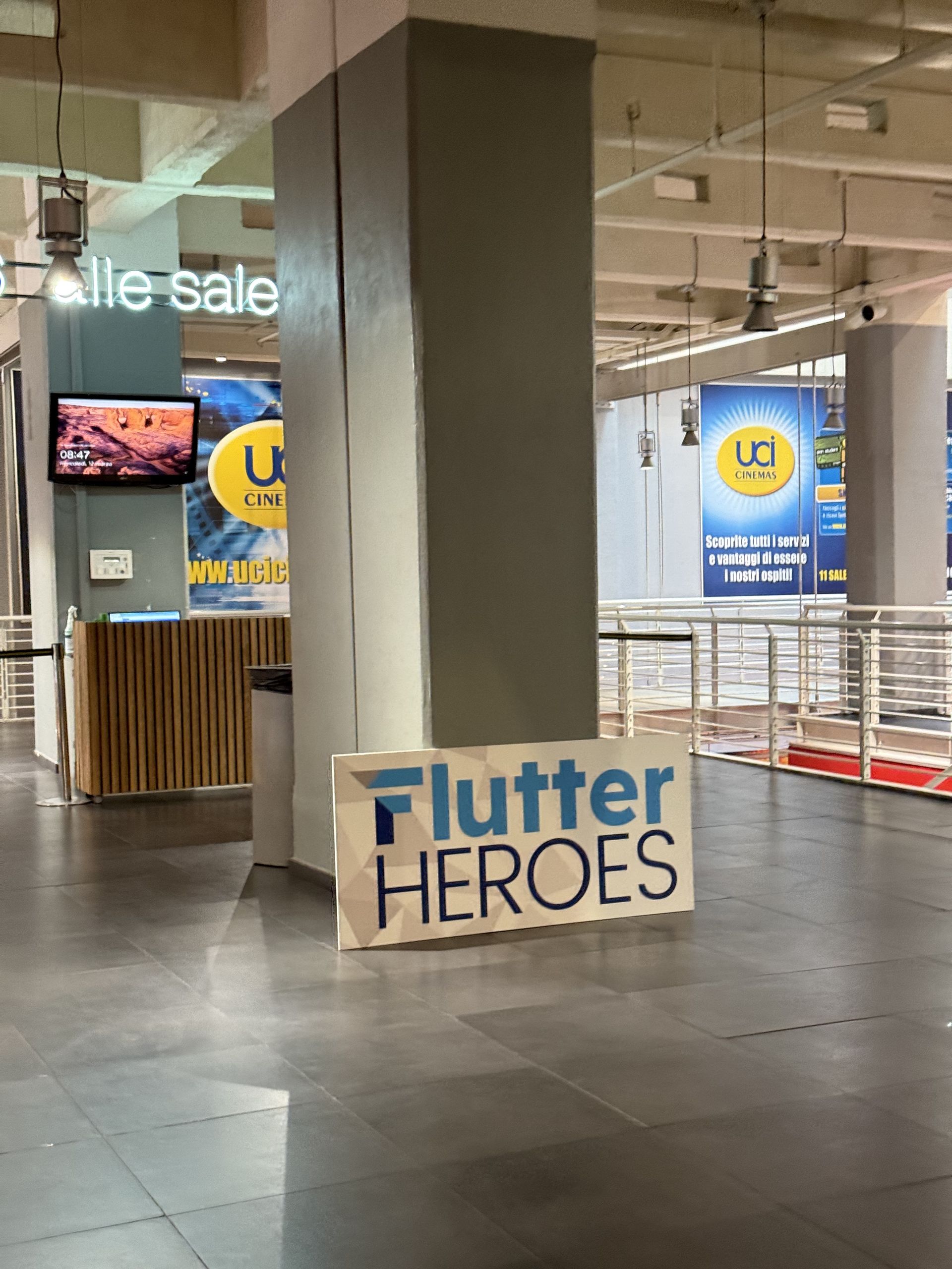 The Flutter HEROES letters seen from the side in the cinema foyer