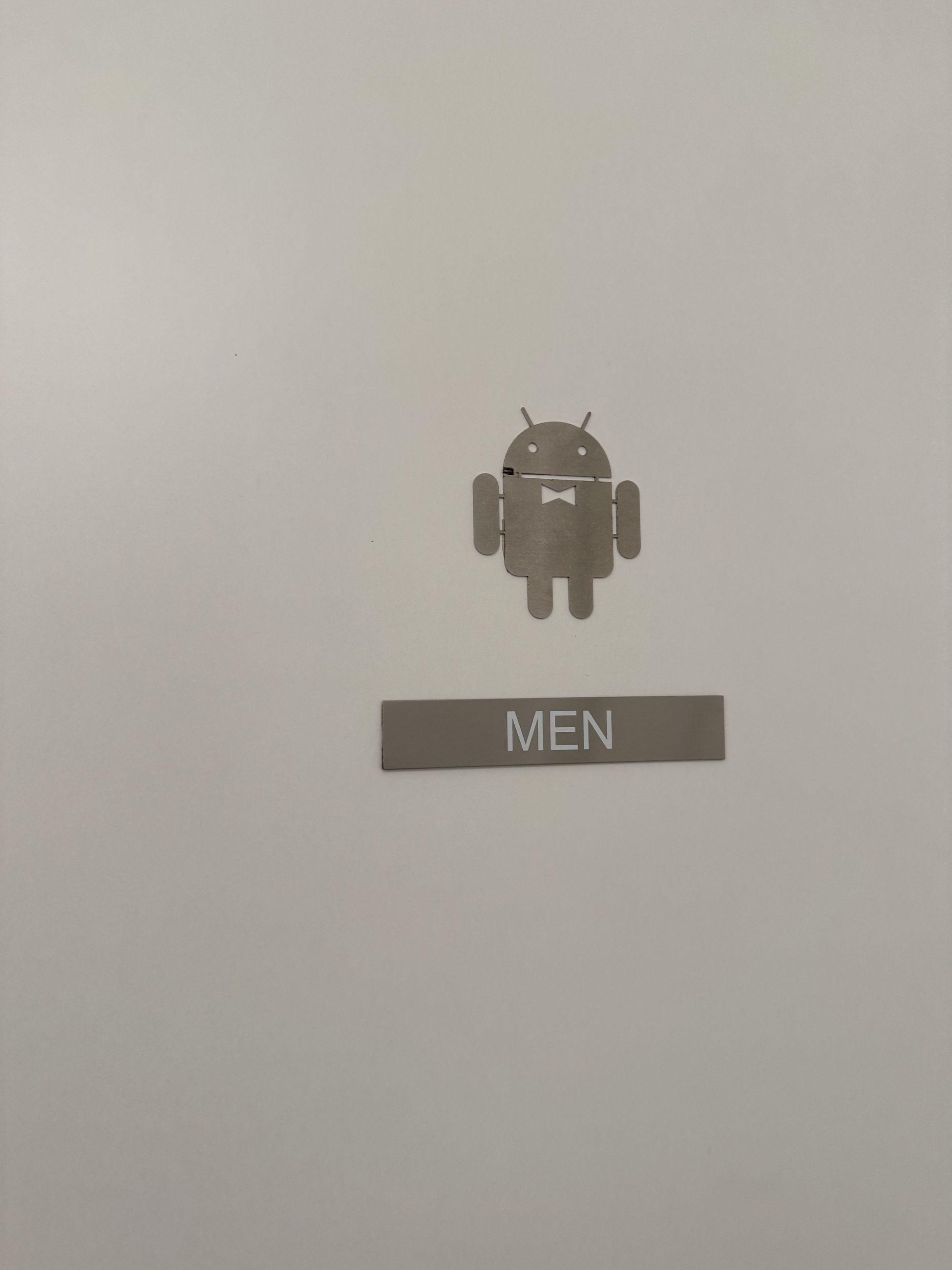 A washroom sign with the Android robot instead of the usual pictogram