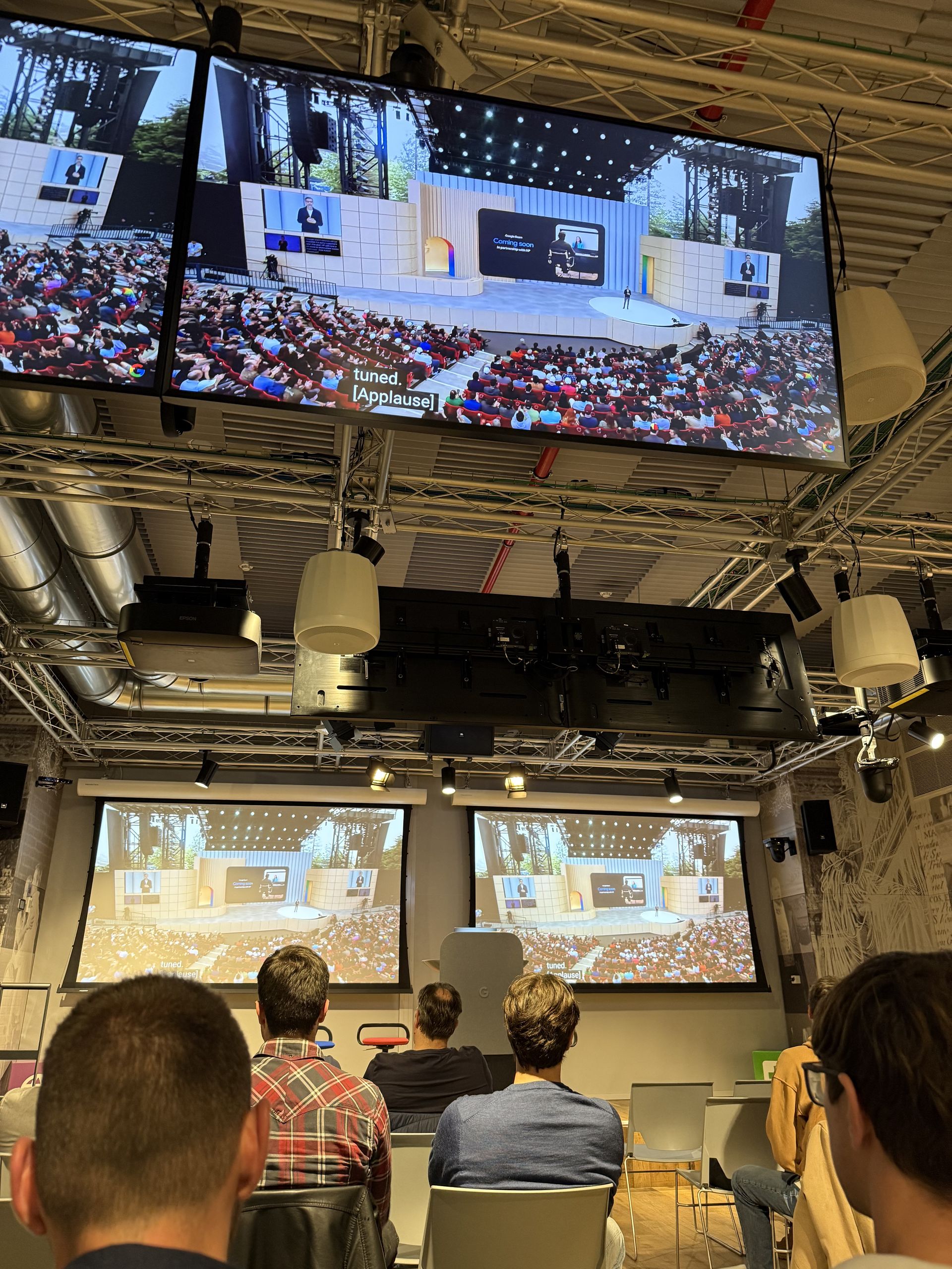 The stage screen reading Coming soon, with live captions below
