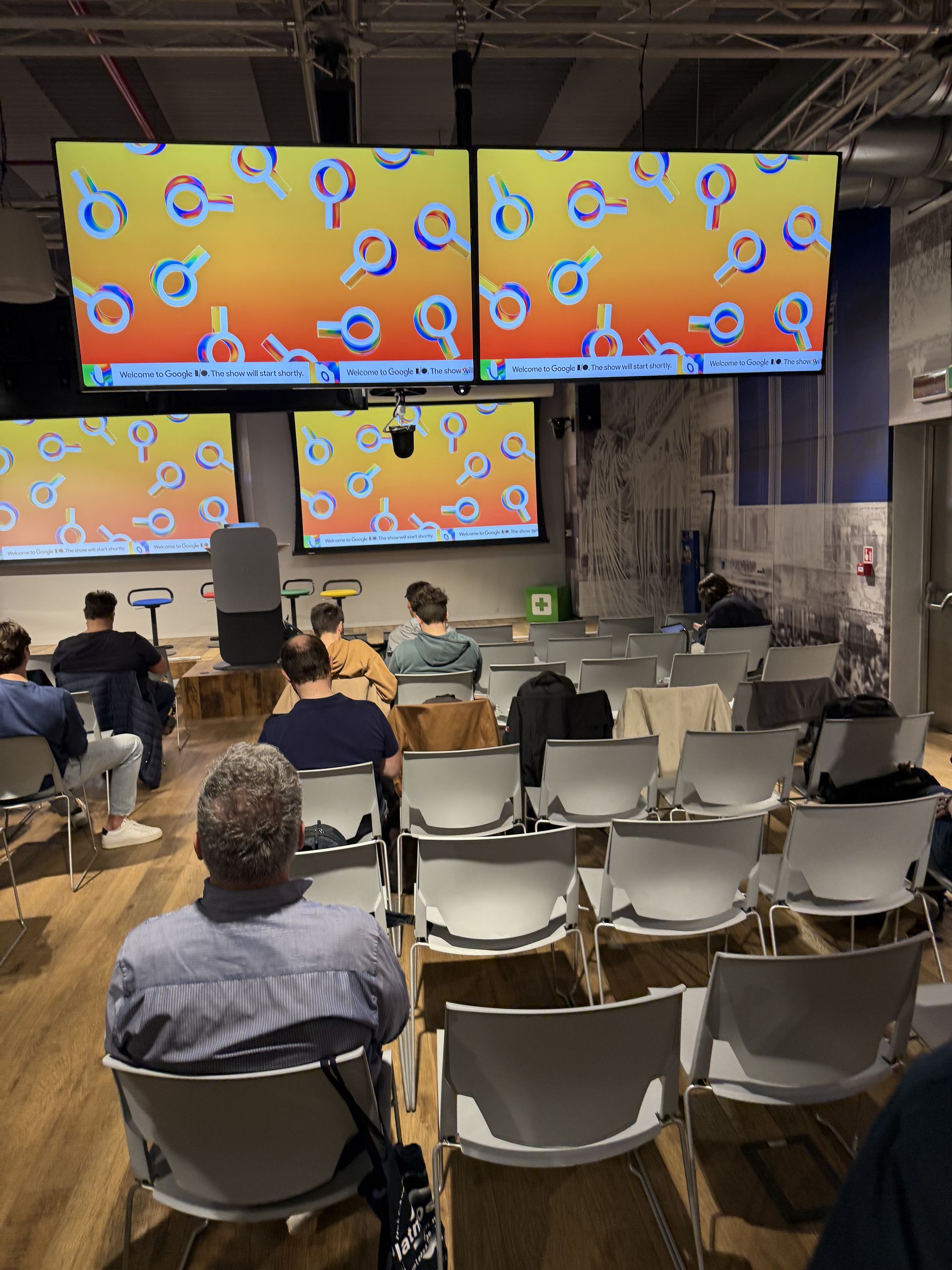 Orange and yellow circles on the screens before the keynote