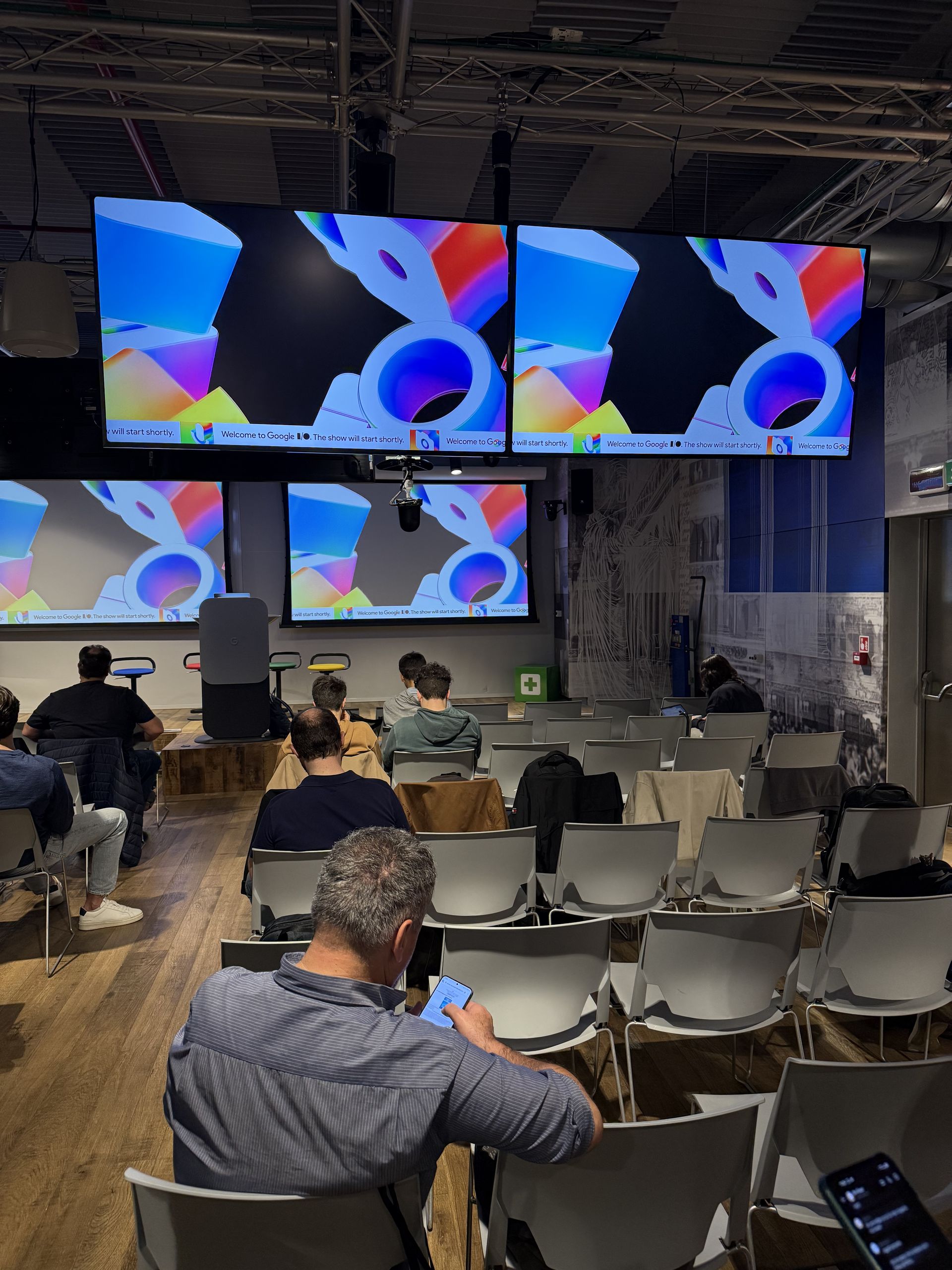 Gradient blobs of the I/O 2025 visual identity on the screens