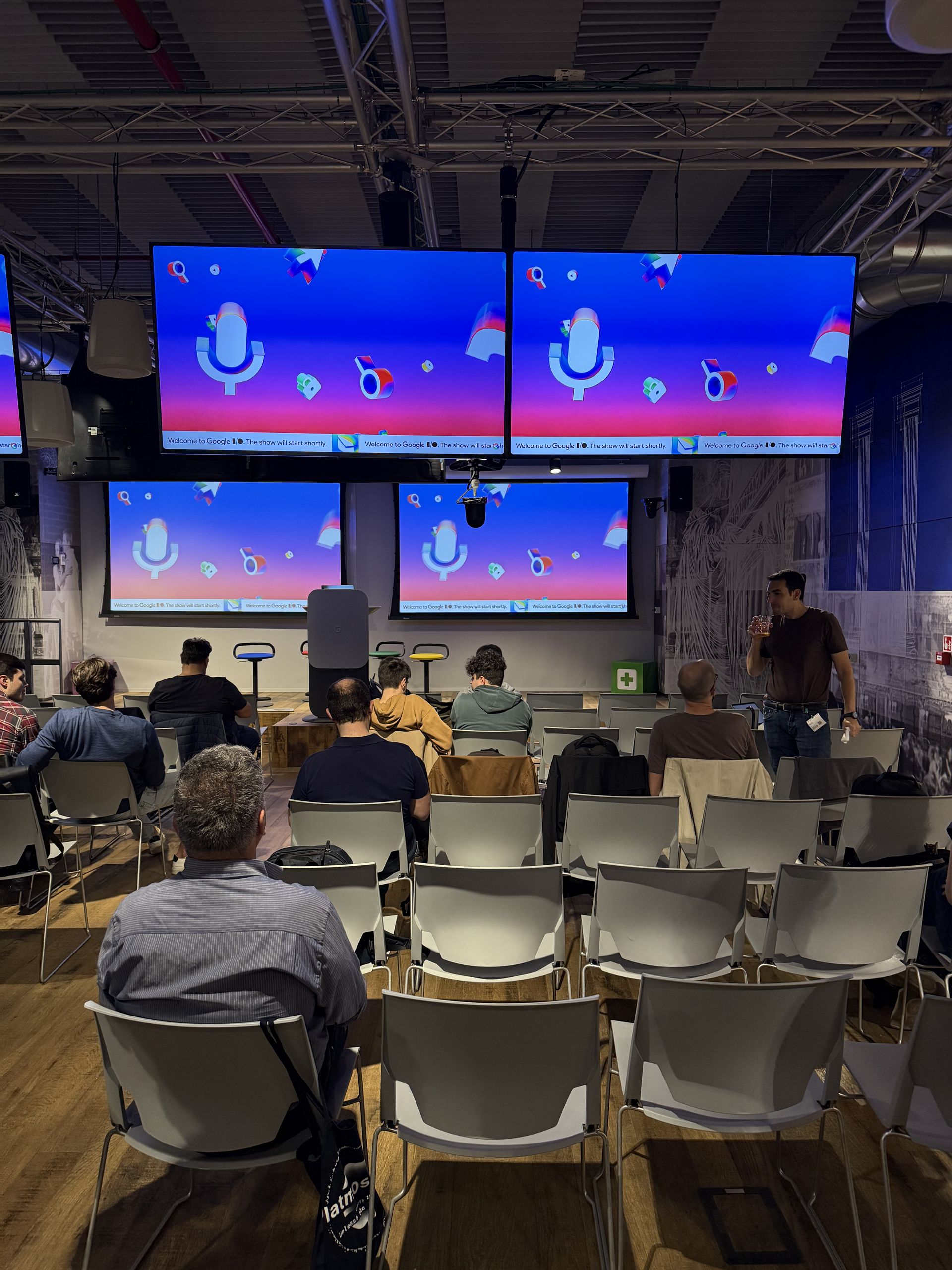 Microphone icons floating across the screens