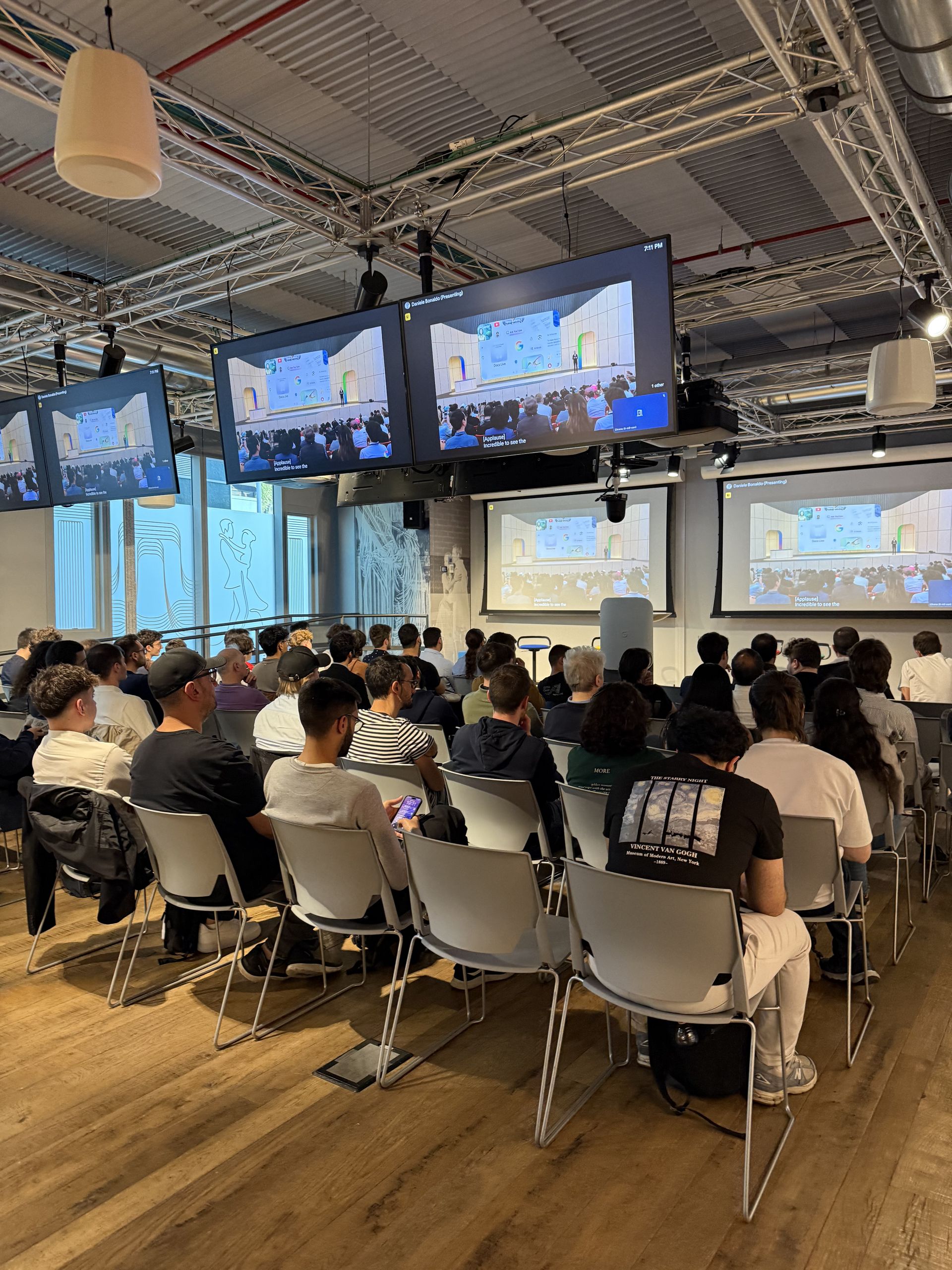 The keynote on the screens over a full room