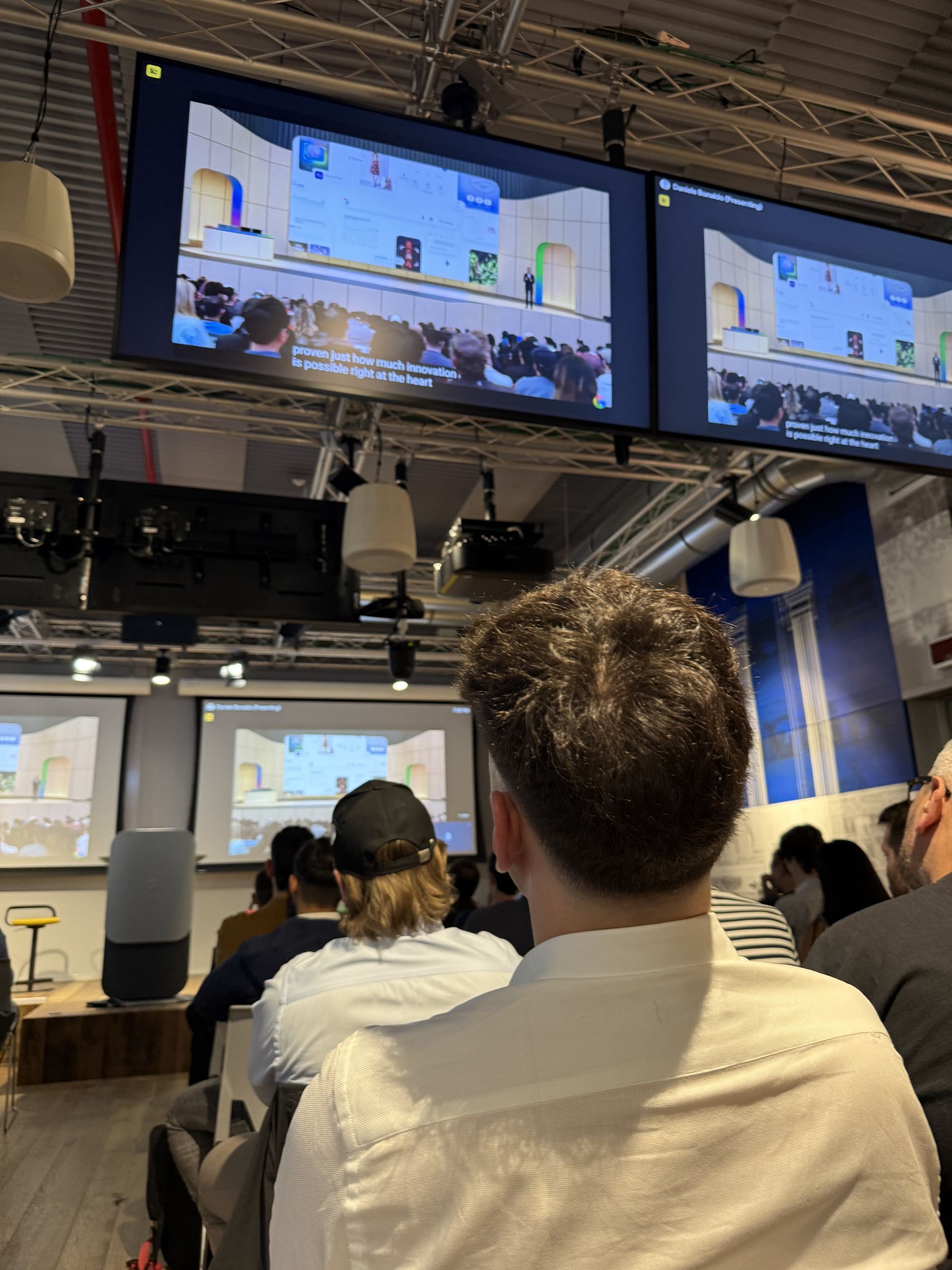 The six screens carrying the keynote over a full room