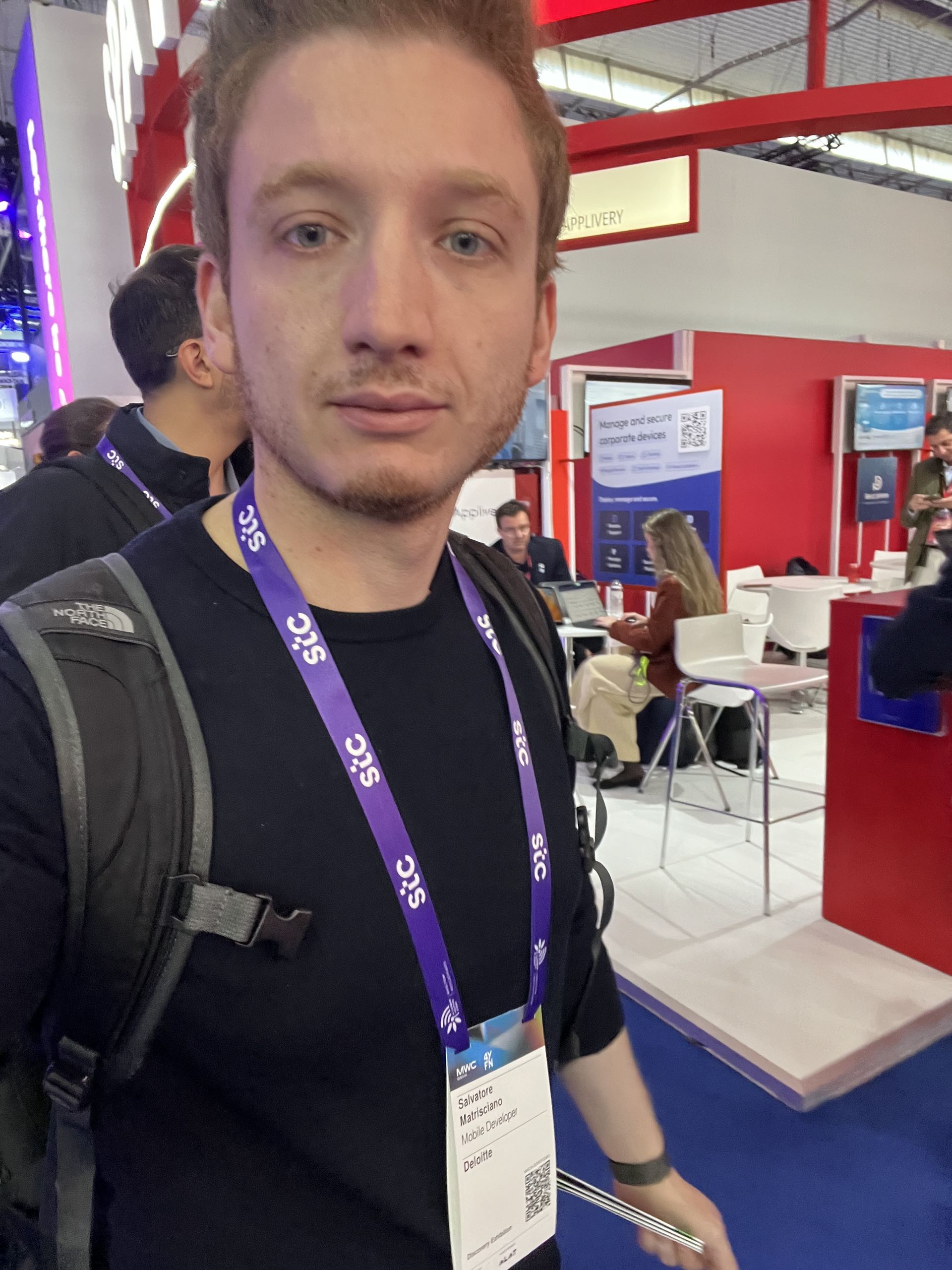 Selfie with the MWC badge and lanyard inside one of the halls