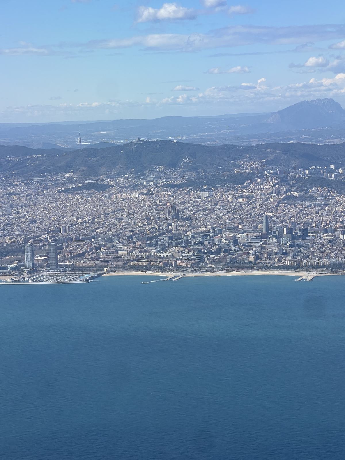 Barcelona and its coastline seen from the plane