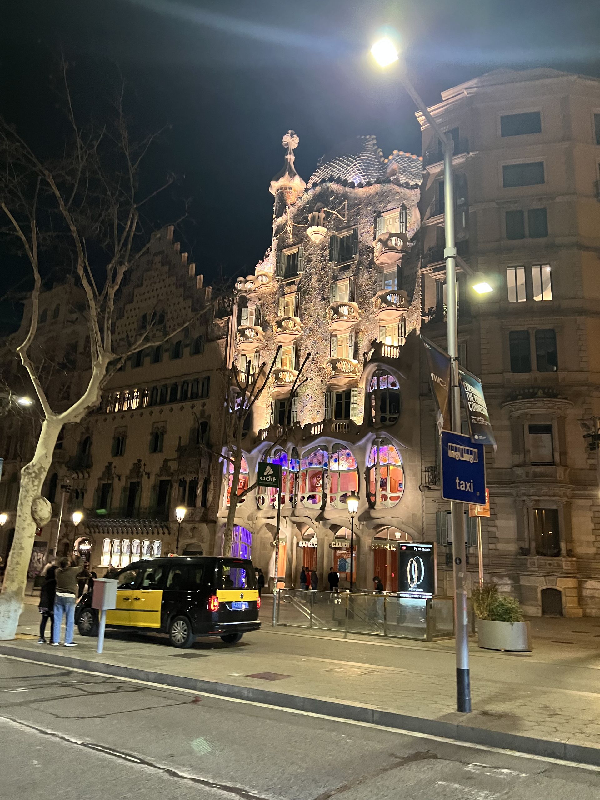 Casa Batlló lit up at night from Passeig de Gràcia
