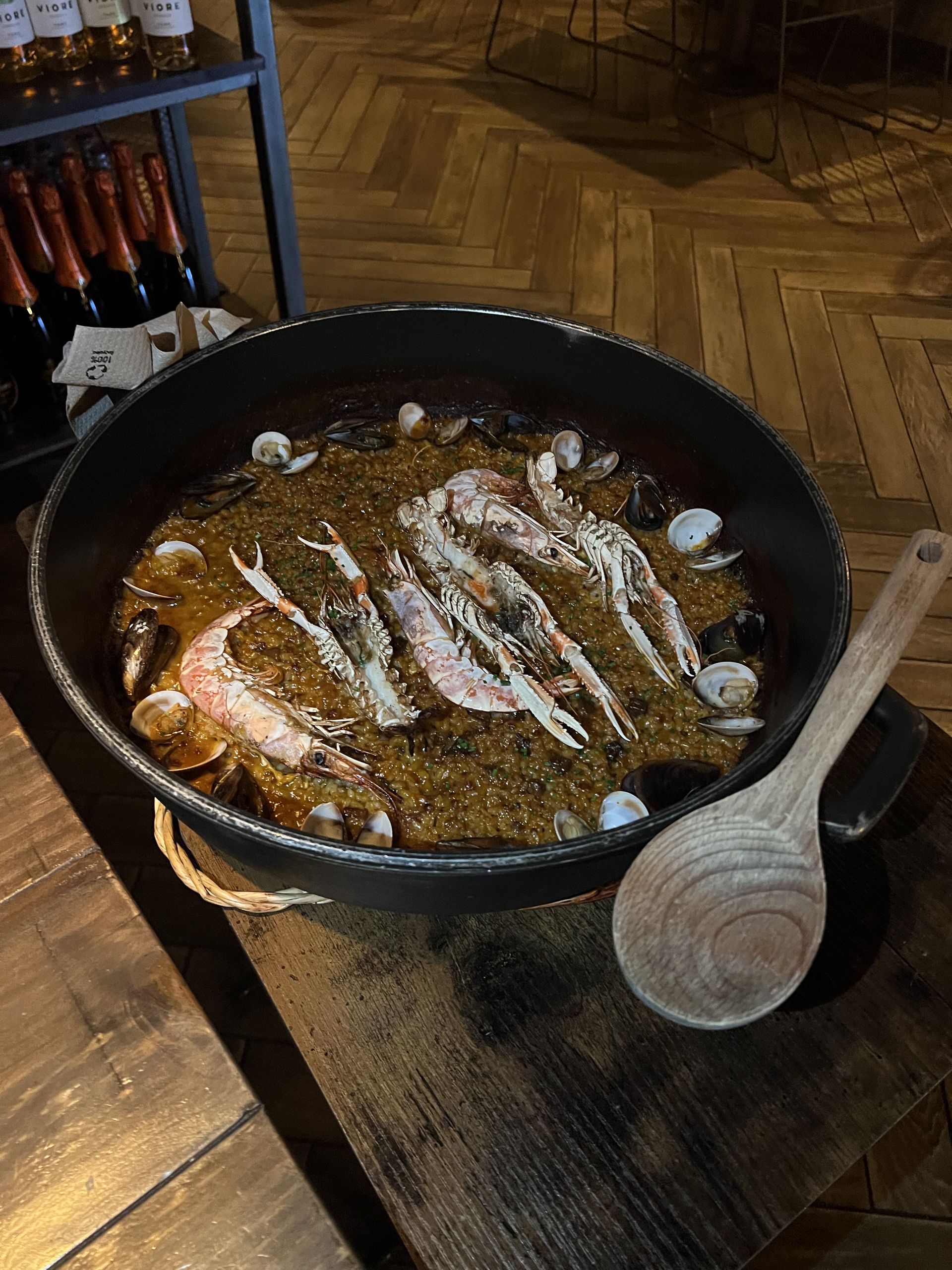 A pan of paella with prawns and clams