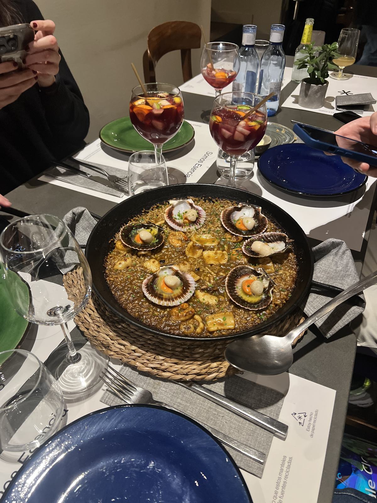 A pan of paella on the table