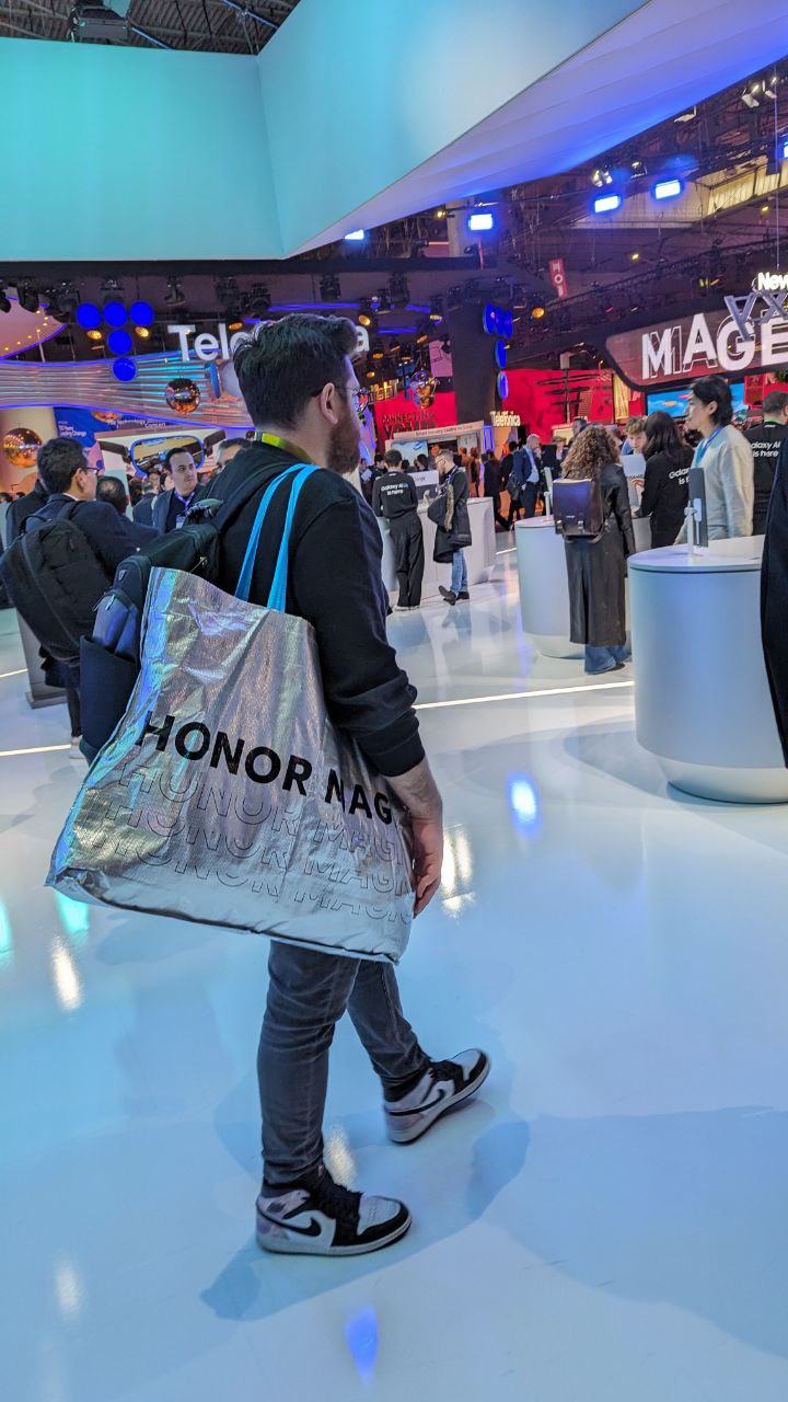 Walking through the hall with an HONOR bag