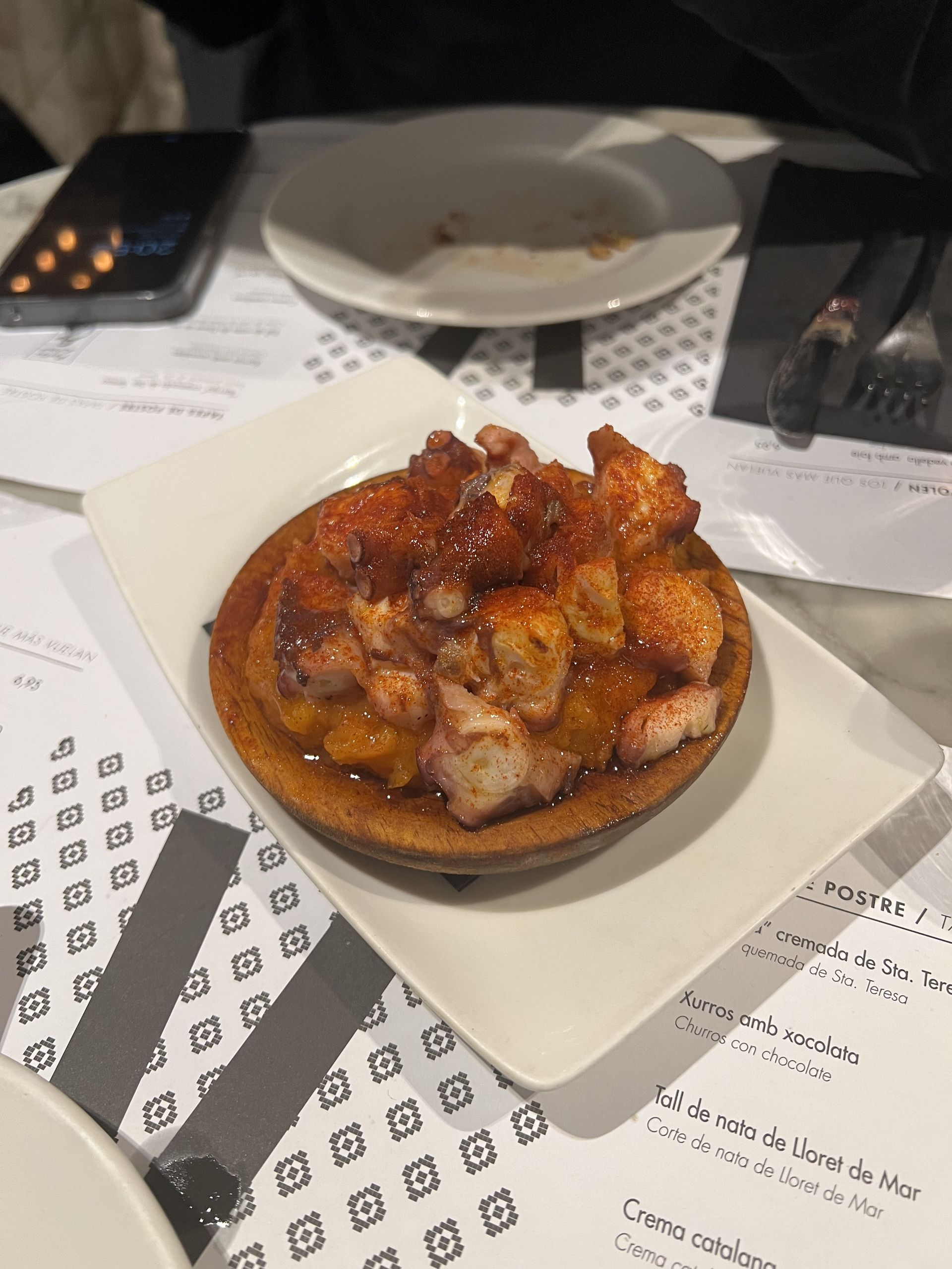 Pulpo a la gallega on a wooden plate